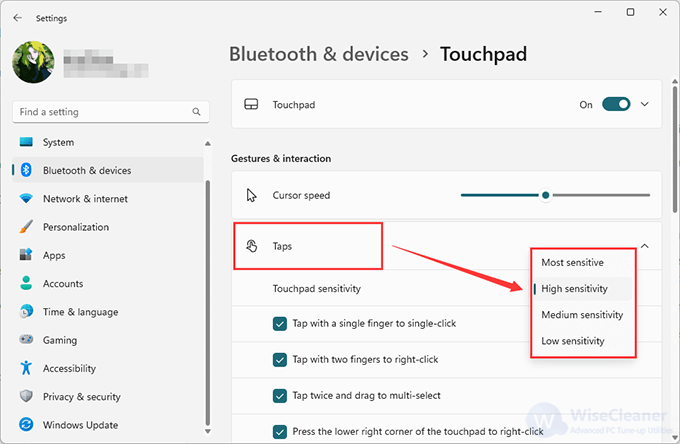 Adjudt Touchpad sensitivity under the Taps item